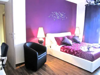 Letto o letti in una camera di Symposium Bed&Breakfast