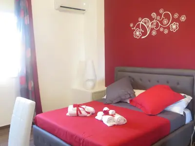 Letto o letti in una camera di Symposium Bed&Breakfast