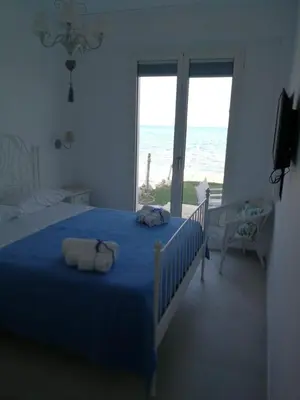 Letto o letti in una camera di Fuga Blu - Piano terra