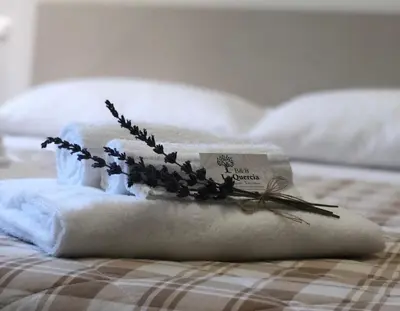Letto o letti in una camera di La Quercia