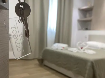 Letto o letti in una camera di La Quercia