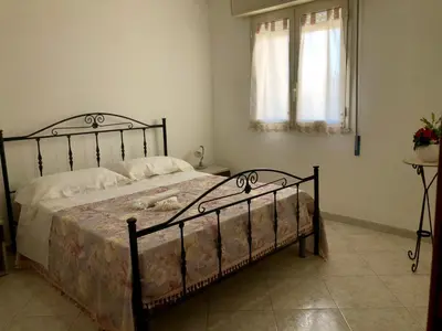 Letto o letti in una camera di Casa Ilenia
