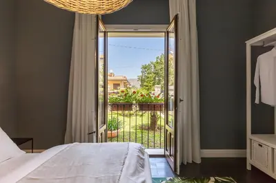 Letto o letti in una camera di Villa Raphael