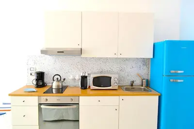 Cucina o angolo cottura di Flamingo SPA Loft by Picasa Sicilia - SEASIDE - SEA & ORTIGIA VIEW