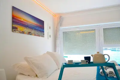 Letto o letti in una camera di Flamingo SPA Loft by Picasa Sicilia - SEASIDE - SEA & ORTIGIA VIEW