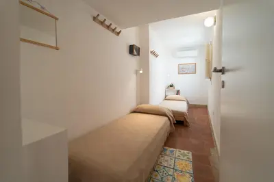 Letto o letti in una camera di GuestHost - Ortigia Colourful Apartment