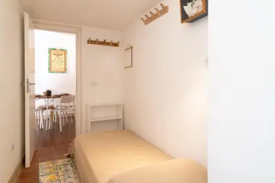 Letto o letti in una camera di GuestHost - Ortigia Colourful Apartment