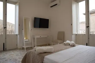 Letto o letti in una camera di Al Corso Apartments