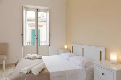 Letto o letti in una camera di Al Corso Apartments
