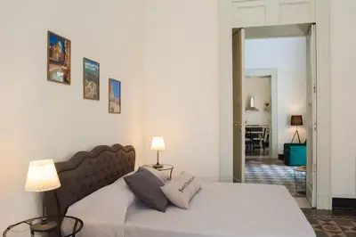 Letto o letti in una camera di Homes4Holidays - Teatro Massimo