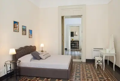 Letto o letti in una camera di Homes4Holidays - Teatro Massimo