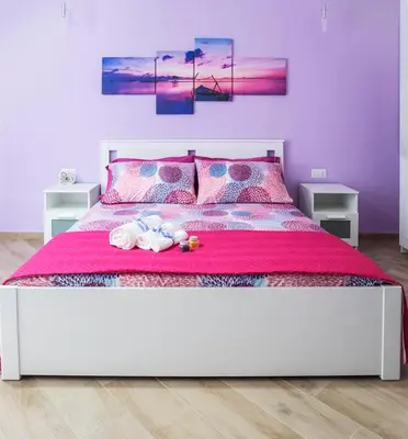 Letto o letti in una camera di Casa Rossini