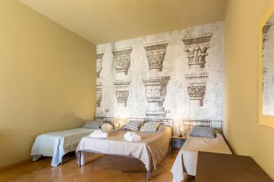 Letto o letti in una camera di Villa Rosaria Rooms