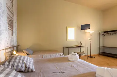 Letto o letti in una camera di Villa Rosaria Rooms