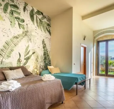 Letto o letti in una camera di Villa Rosaria Rooms