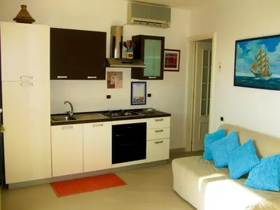 Cucina o angolo cottura di The Golden Rainbow - SEAFRONT apartments