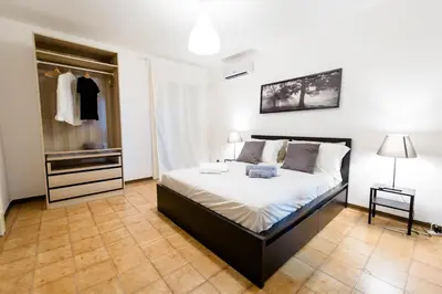 Letto o letti in una camera di City Center Apartments Catania