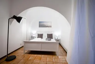 Letto o letti in una camera di City Center Apartments Catania