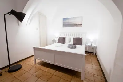 Letto o letti in una camera di City Center Apartments Catania