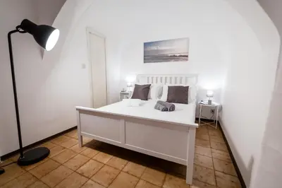 Letto o letti in una camera di City Center Apartments Catania