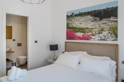 Letto o letti in una camera di AmaSi Affittacamere