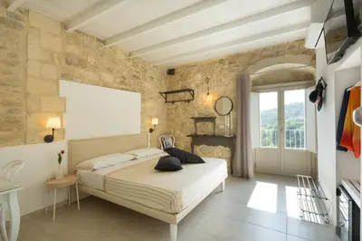 Letto o letti in una camera di Evoca