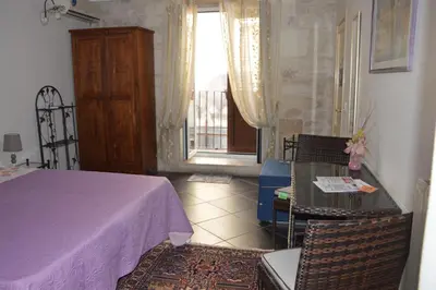 Letto o letti in una camera di B&B Al cortiletto Modica centro