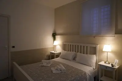Letto o letti in una camera di Magrì Apartments Catania