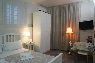 Letto o letti in una camera di Magrì Apartments Catania