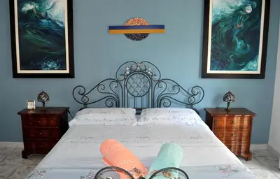 Letto o letti in una camera di Arte' rooms, nel cuore di Siracusa