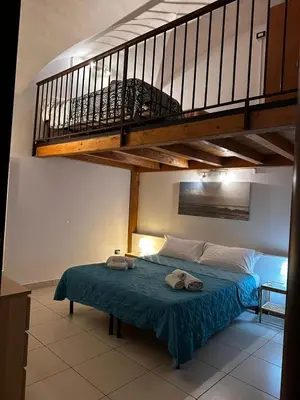 Letto o letti in una camera di Dimora 394