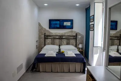 Letto o letti in una camera di Fausto's House 2