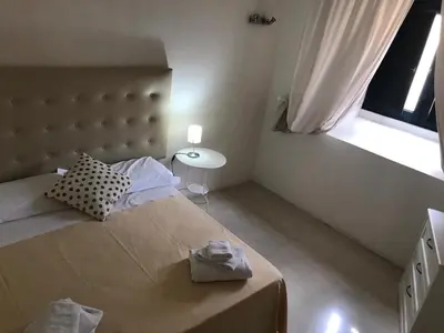 Letto o letti in una camera di Landolina Palace Hotel