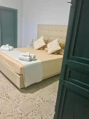 Letto o letti in una camera di Landolina Palace Hotel