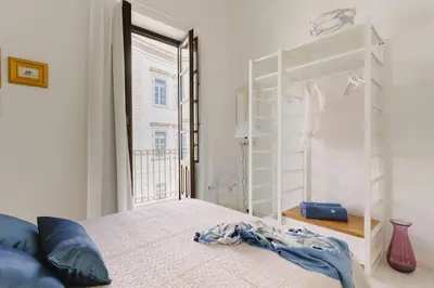 Letto o letti in una camera di Suite La Piazza by Wonderful Italy