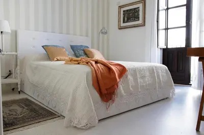 Letto o letti in una camera di Suite La Piazza by Wonderful Italy