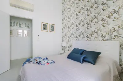 Letto o letti in una camera di Suite La Piazza by Wonderful Italy