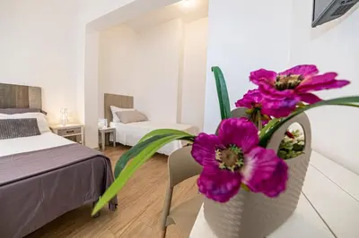 Letto o letti in una camera di B&B - Le Tre Comari