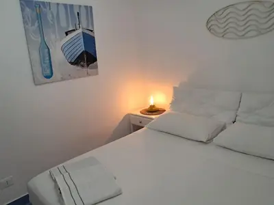 Letto o letti in una camera di Falso pepe Marzamemi