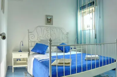 Letto o letti in una camera di Villa Doris