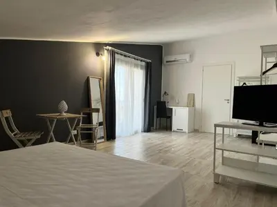 TV o dispositivi per l'intrattenimento presso Amada Hotel Siracusa