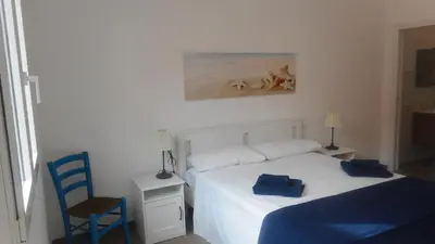 Letto o letti in una camera di Trinacria Bedda