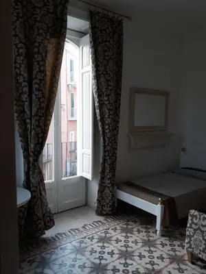 Letto o letti in una camera di Via Pezza 100
