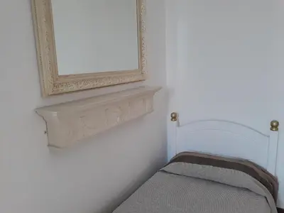 Letto o letti in una camera di Via Pezza 100