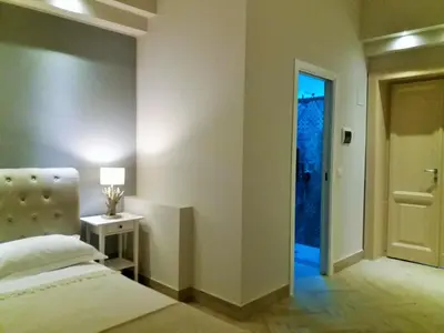 Letto o letti in una camera di B&B Oriental Palace