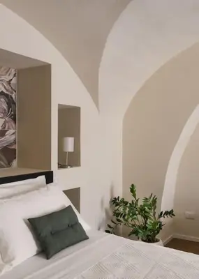 Letto o letti in una camera di Le Pennellate Short Lets