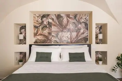 Letto o letti in una camera di Le Pennellate Short Lets