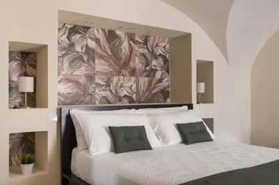 Letto o letti in una camera di Le Pennellate Short Lets