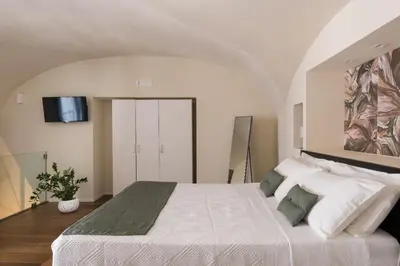 Letto o letti in una camera di Le Pennellate Short Lets