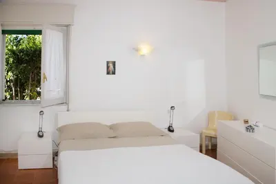Letto o letti in una camera di Villa Iaia